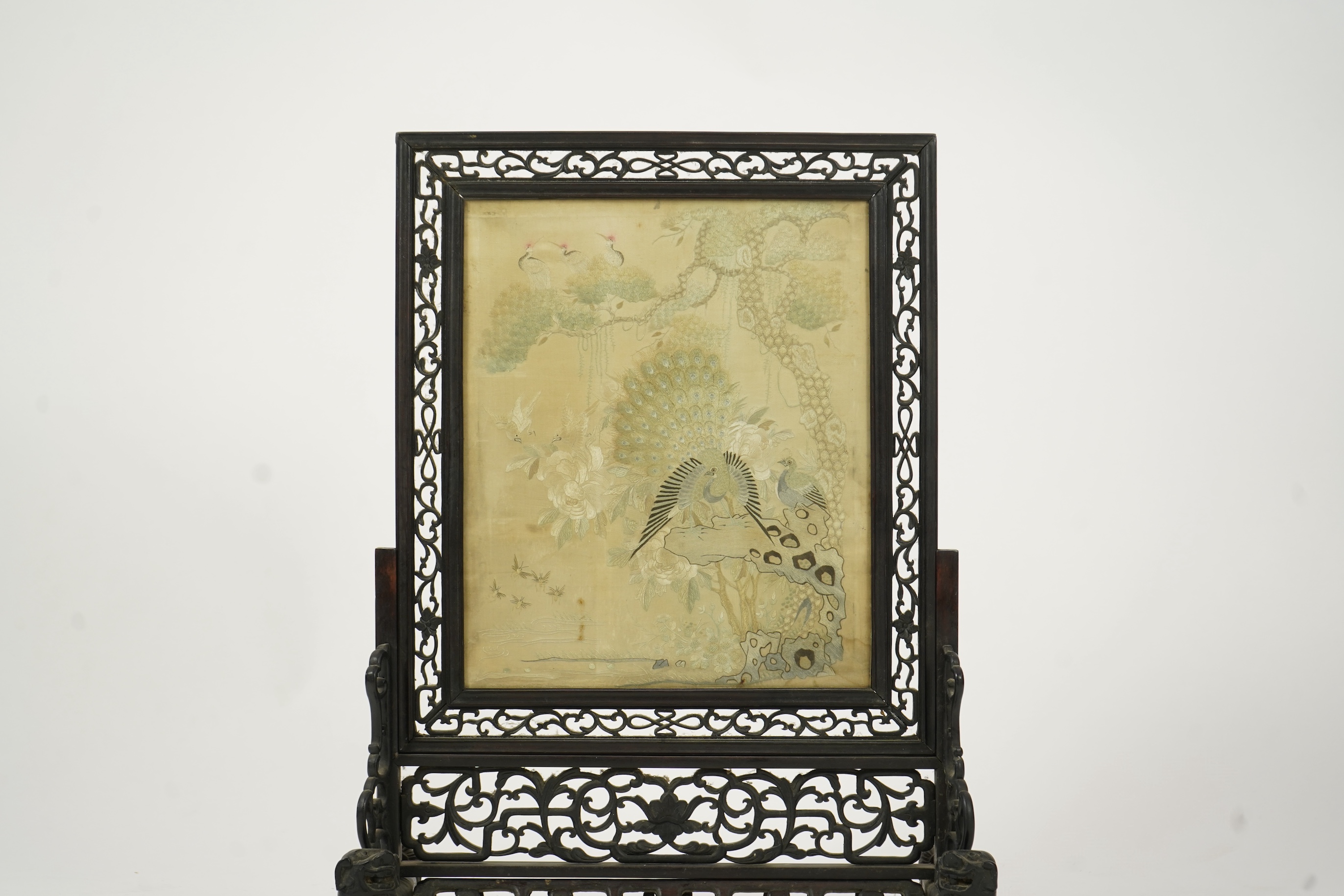 A Chinese ’Hundred bird’ embroidered silk table screen and hongmu stand, late 19th/early 20th century